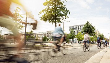 A group of moving cyclists in the city